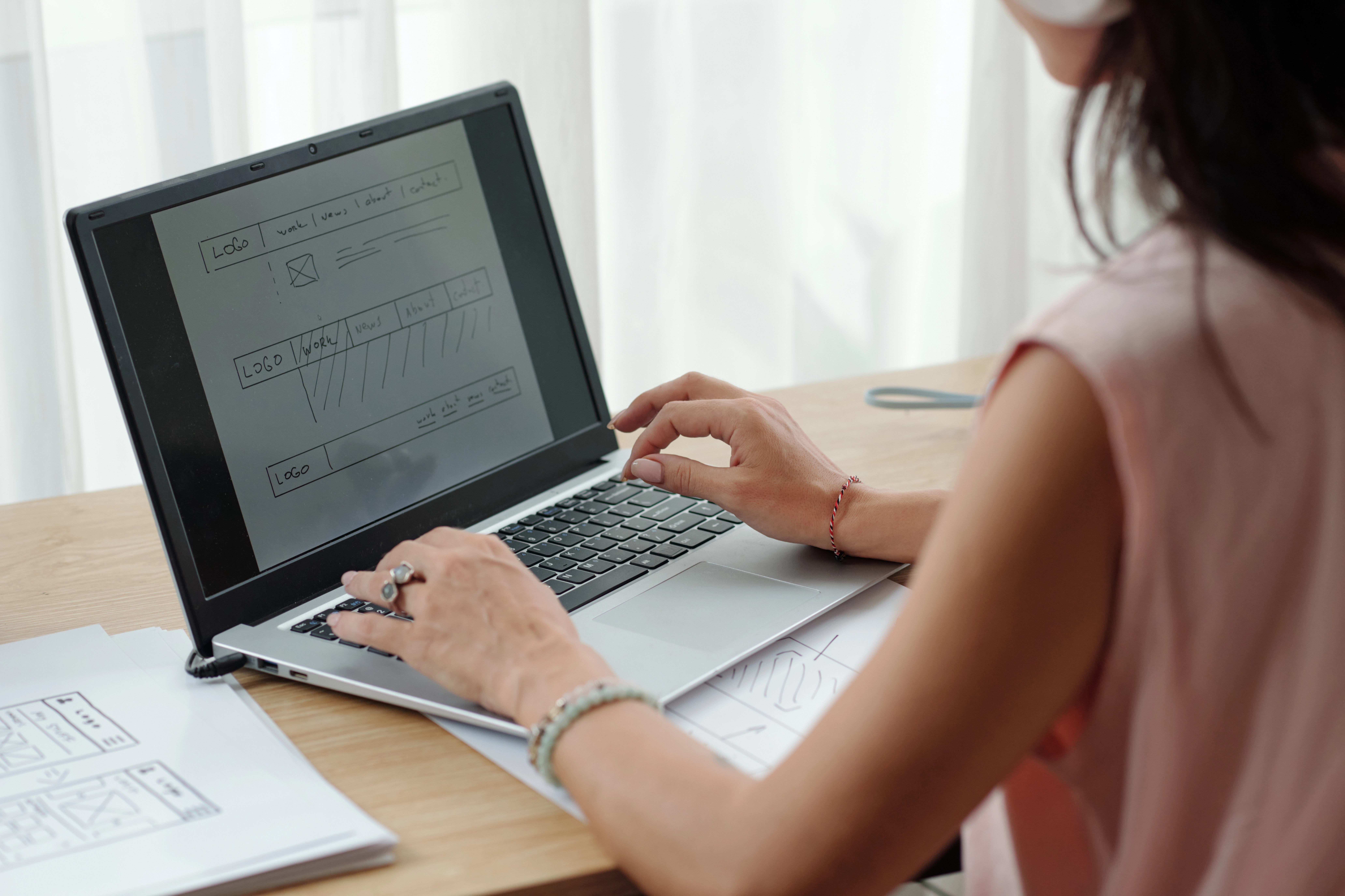 analyzing website design on laptop with keen focus 2025 02 11 14 04 59 utc