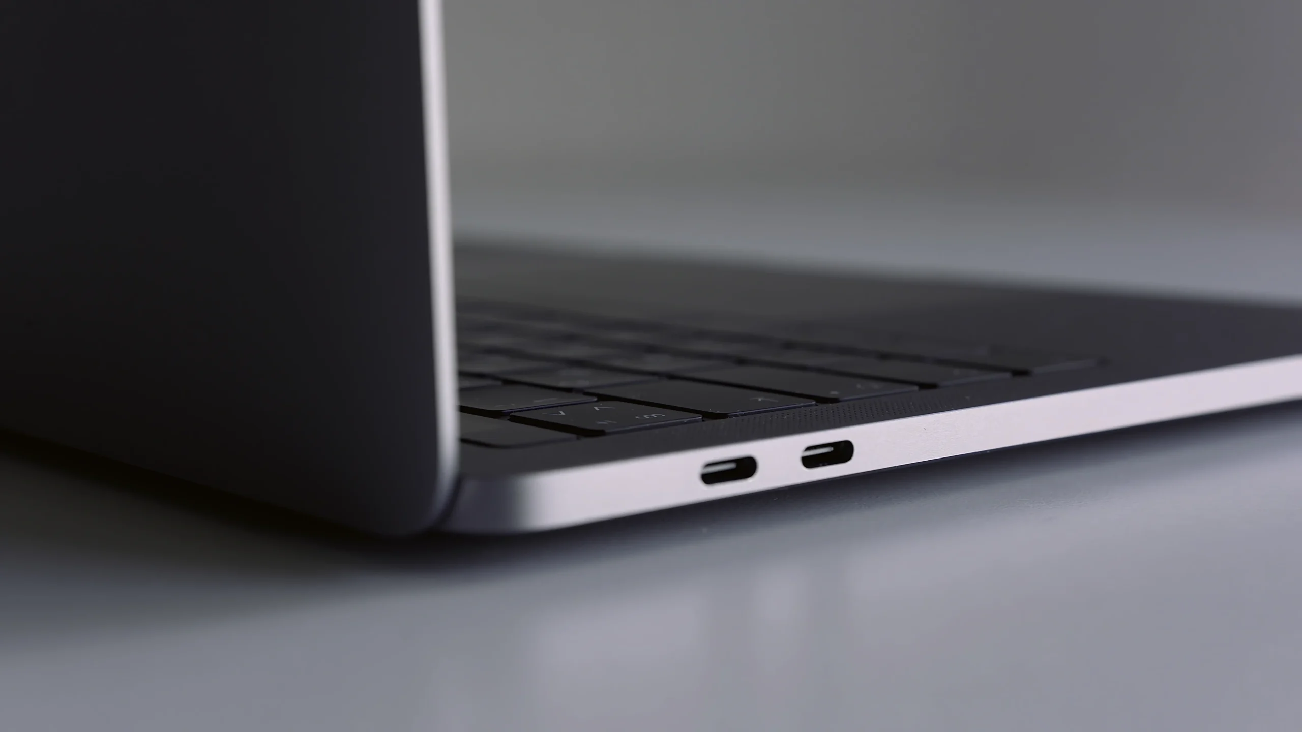 close up side view of silver laptop on white table 2024 12 06 18 11 24 utc